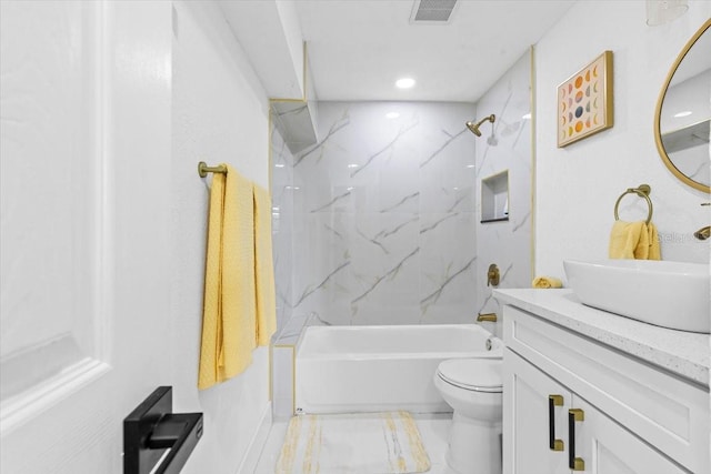 full bathroom with vanity, toilet, and tiled shower / bath combo