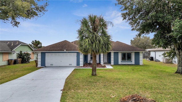 single story home with a garage and a front lawn