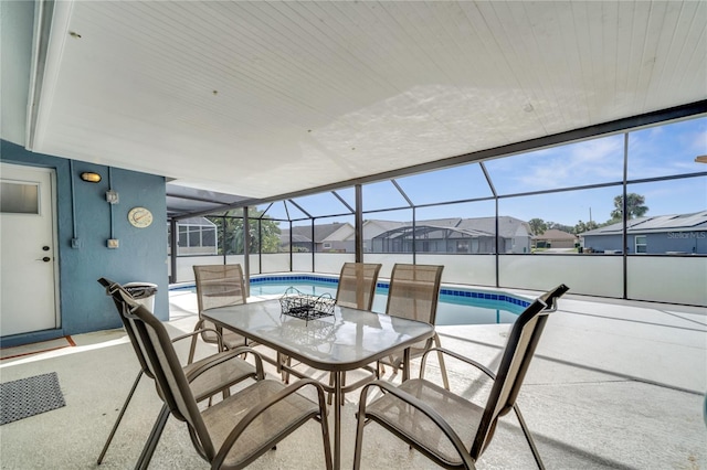 sunroom / solarium featuring a pool