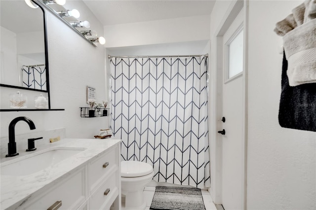 bathroom featuring vanity, a shower with curtain, toilet, and tile patterned floors