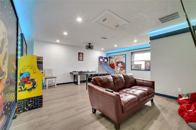 home theater with light hardwood / wood-style flooring