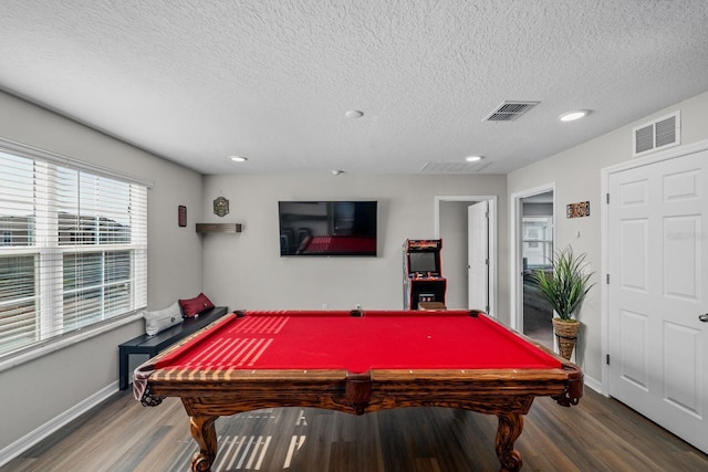 recreation room with pool table, a textured ceiling, and hardwood / wood-style floors