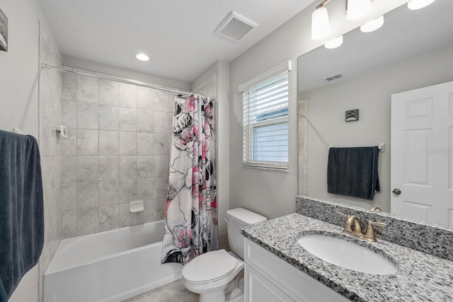 full bathroom featuring a textured ceiling, toilet, vanity, and shower / tub combo with curtain