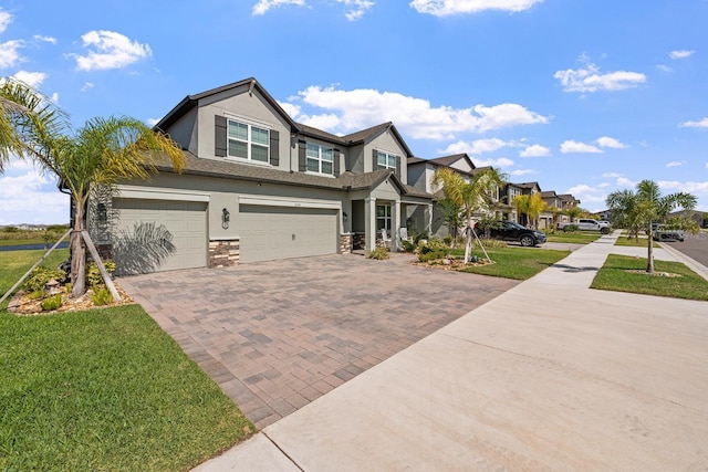 view of front facade with a front lawn and a garage