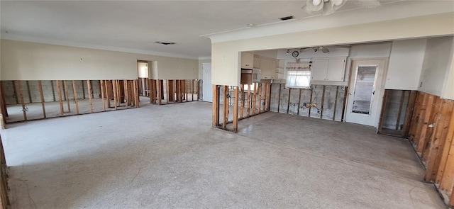 spare room featuring crown molding and ceiling fan