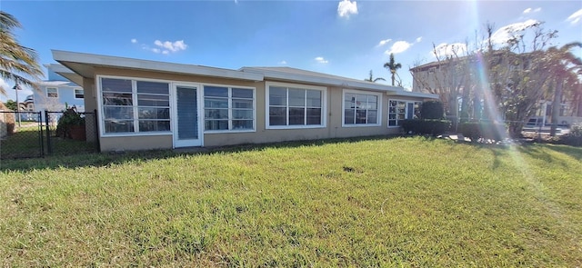 back of house with a yard