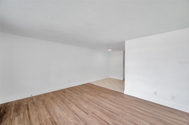 unfurnished room with light hardwood / wood-style floors