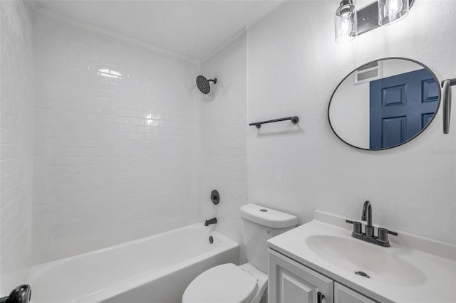 full bathroom featuring vanity, toilet, and tiled shower / bath combo