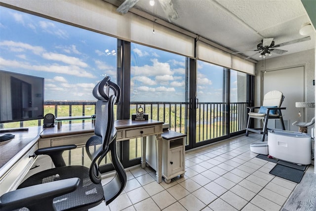 sunroom with a wealth of natural light and ceiling fan