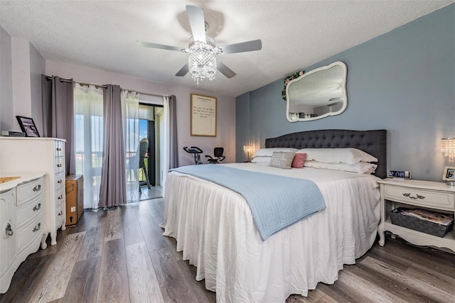 bedroom featuring a textured ceiling, ceiling fan, and dark hardwood / wood-style floors