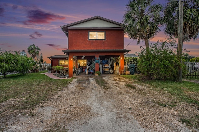 view of front of home featuring a lawn