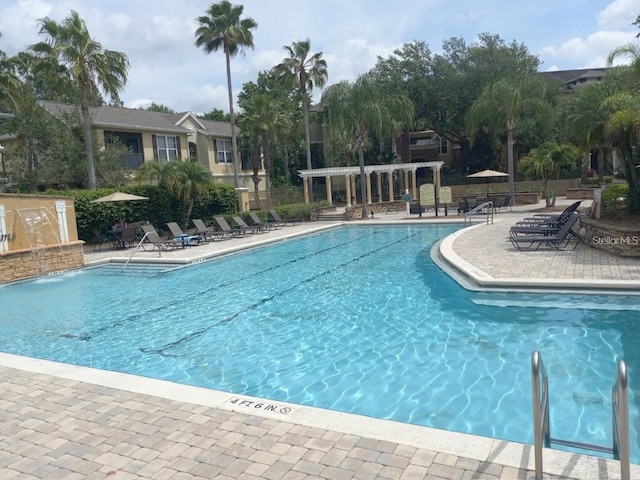 view of pool featuring a patio area