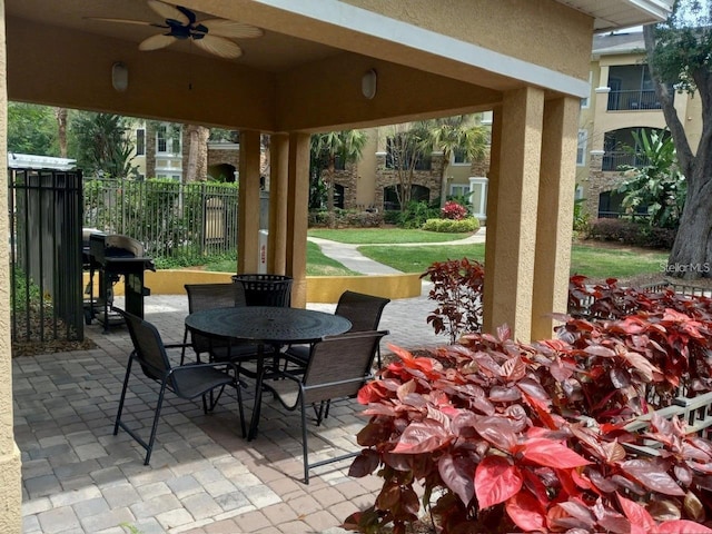 view of patio featuring area for grilling and ceiling fan