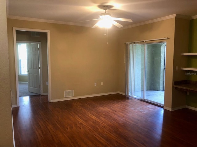 unfurnished room with crown molding, ceiling fan, and dark hardwood / wood-style flooring