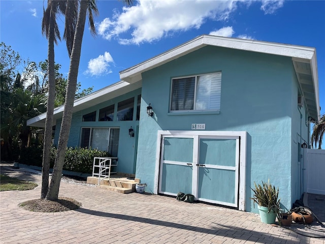 exterior space featuring stucco siding