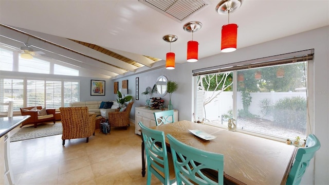 dining space with lofted ceiling with beams, ceiling fan, and visible vents