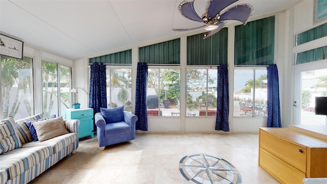 sunroom / solarium featuring vaulted ceiling and a ceiling fan