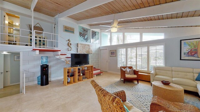 living area with ceiling fan, stairway, wooden ceiling, and vaulted ceiling with beams