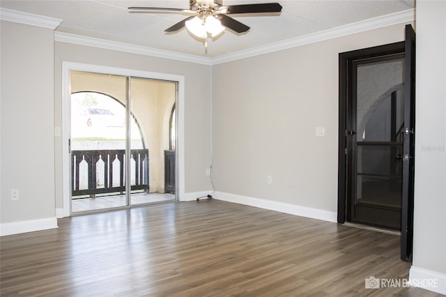 unfurnished room featuring dark wood-type flooring, crown molding, a textured ceiling, and ceiling fan