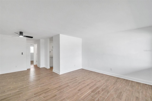 spare room with light hardwood / wood-style floors and ceiling fan