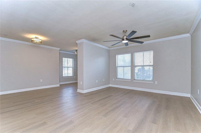 empty room with light hardwood / wood-style flooring, ceiling fan, and crown molding