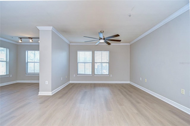 spare room with light hardwood / wood-style flooring, rail lighting, ceiling fan, and crown molding