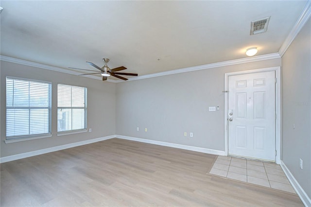 foyer with light hardwood / wood-style floors, ceiling fan, and crown molding