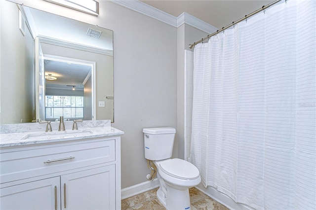 bathroom with crown molding, vanity, tile patterned floors, and toilet