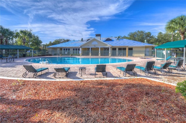 view of swimming pool with a patio area