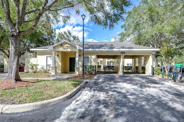 view of front of property with a carport