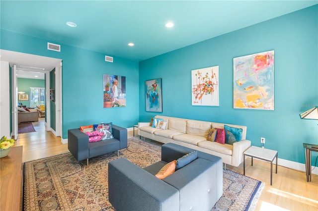 living room with light hardwood / wood-style floors