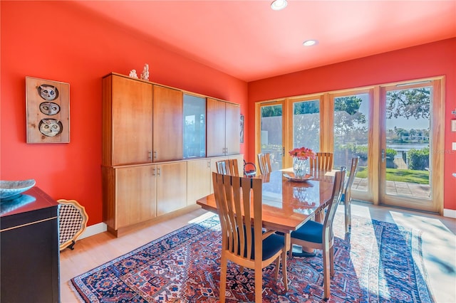 dining area with light hardwood / wood-style flooring