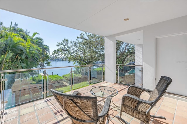 balcony featuring a water view