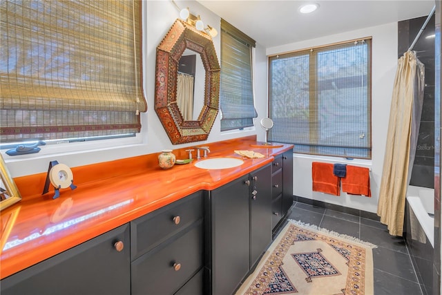 bathroom with vanity, shower / bath combination with curtain, and tile patterned floors