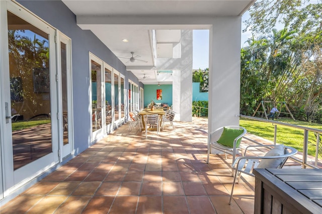 view of patio with french doors and ceiling fan