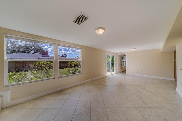 unfurnished room featuring light tile patterned flooring