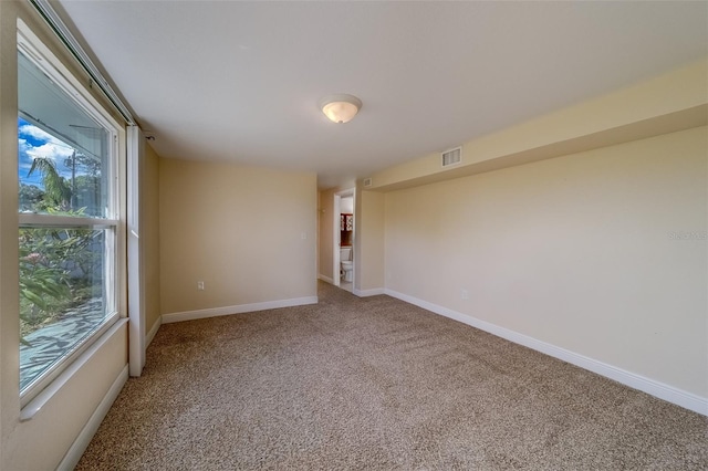 spare room with carpet flooring