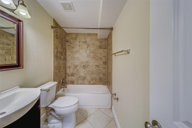 full bathroom featuring vanity, tile patterned floors, toilet, and tiled shower / bath