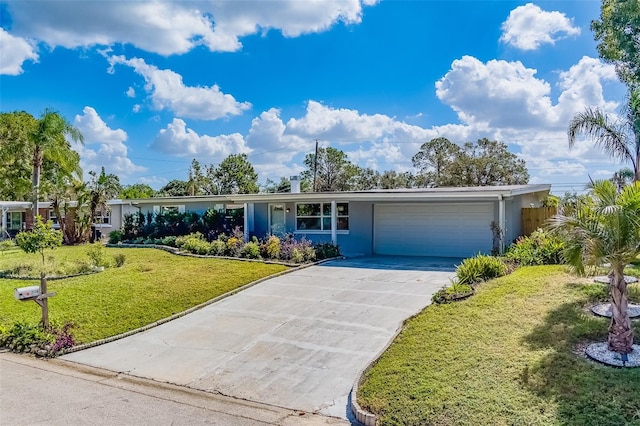 ranch-style home with a garage and a front lawn