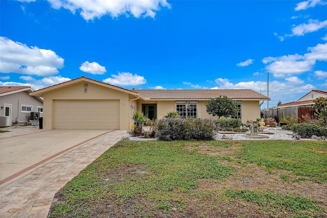 ranch-style house with a front lawn and a garage