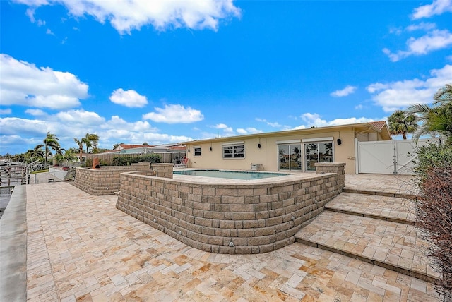 view of patio / terrace featuring a fenced in pool