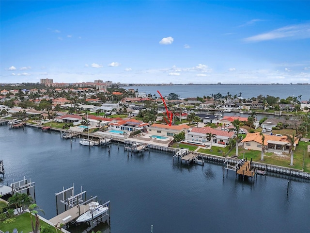 birds eye view of property with a water view