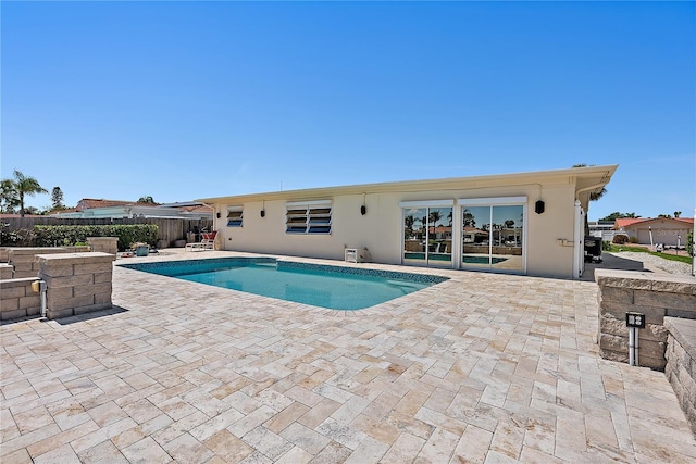 view of swimming pool with fence, a patio area, and a fenced in pool