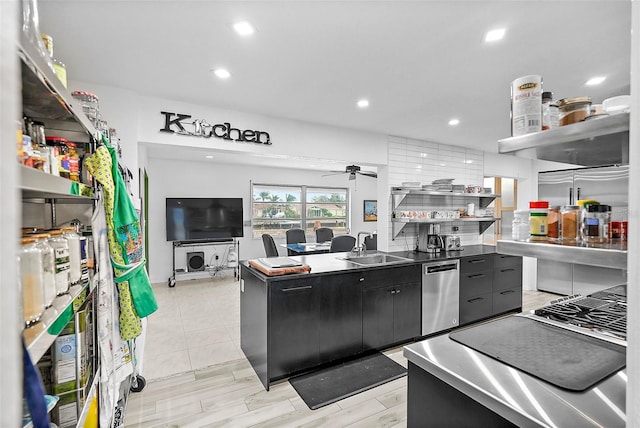 kitchen featuring dishwasher, a sink, open shelves, and ceiling fan