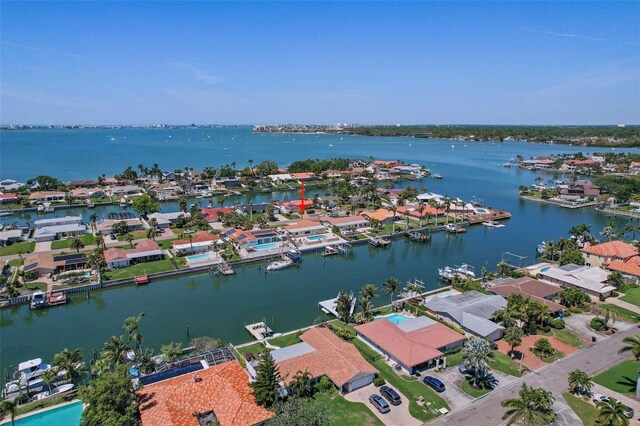 birds eye view of property featuring a water view and a residential view