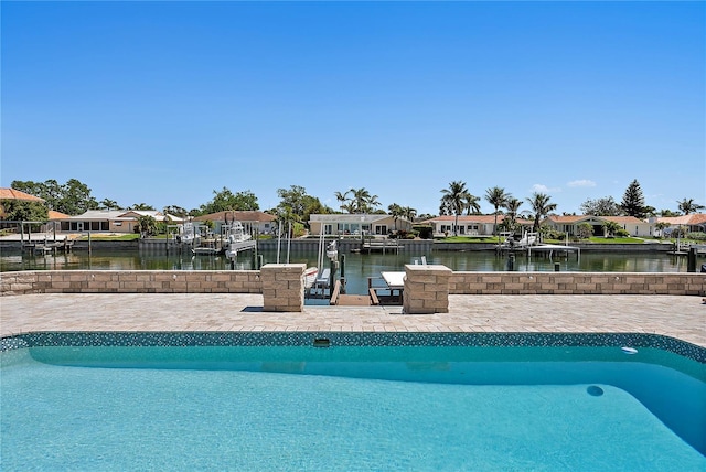 pool featuring a water view and a residential view