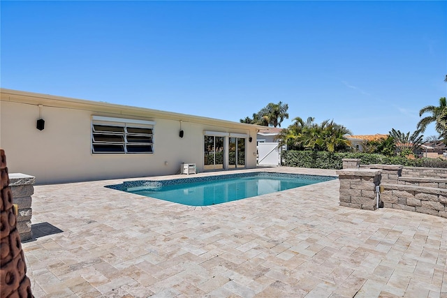 outdoor pool featuring a patio