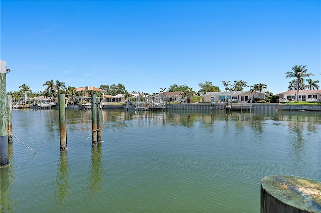 view of water feature featuring a residential view and a dock