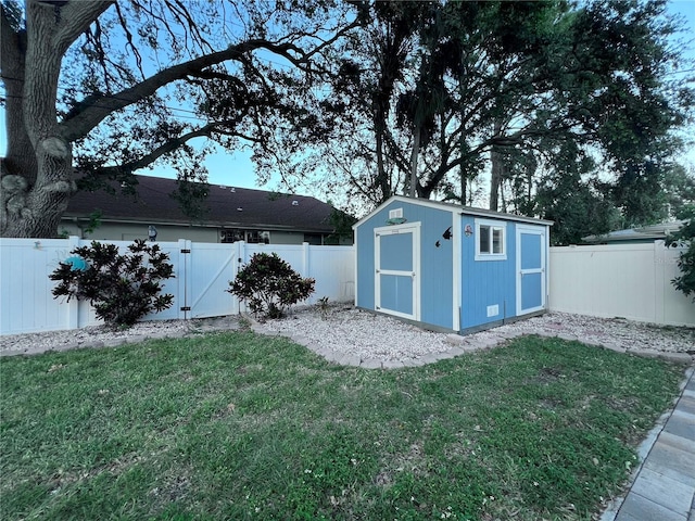 view of shed with a fenced backyard