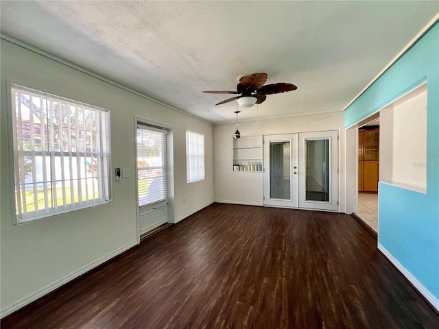 interior space with french doors and a ceiling fan